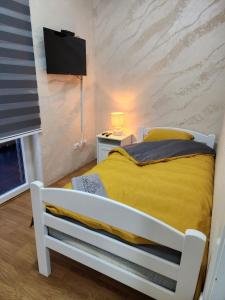 Postel nebo postele na pokoji v ubytování Apartman Relja + 2 fotografie