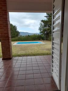 a view from a door of a swimming pool at Casa en Potrero de Garay in Potrero de Garay