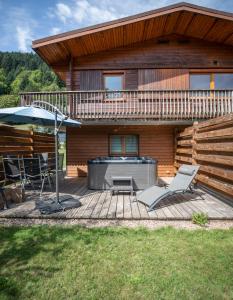 Zahrada ubytování Chalets du Bouchot & Jacuzzi privatif proximité Gerardmer & La Bresse