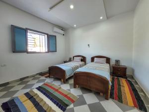 Postel nebo postele na pokoji v ubytování Villa Naima + 37 fotografií