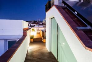 an empty balcony of a building with a roof at Bo&Co Apartments in Sitges