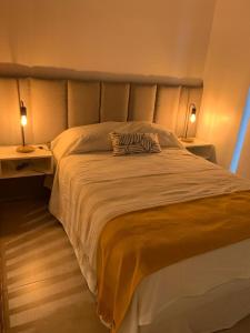 Een bed of bedden in een kamer bij TERRA-BARRIO NORTE