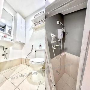 a bathroom with a shower and a toilet and a sink at Me N’ My Bed Staycation @ SMDC Trees Residences in Manila