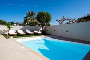 a swimming pool in the backyard of a house at Searenity Villa Malia with private swimming pool in Malia