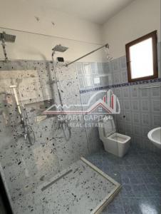 a bathroom with a shower and a toilet at house for rent vlore in Vlorë