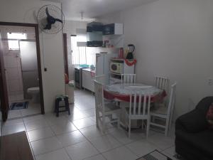 a kitchen and dining room with a table and chairs at Casa da ana in Penha