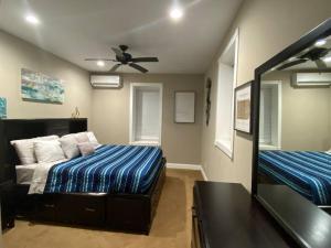 a bedroom with a bed and a ceiling fan at Entire 2 Bed apartment in Allentown