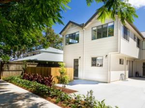 a white house with a fence at Beautiful Mountain Townhouse Entire home to yourself in Beerwah