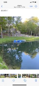 two pictures of a lake with boats in the water at Catskills Pond Getaway in Liberty