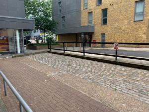 a cobblestone street in front of a building at Brockmer House in London