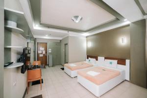 Postel nebo postele na pokoji v ubytování GC Hotel + 13 fotografií