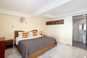 Postel nebo postele na pokoji v ubytování Tropical Villa 3