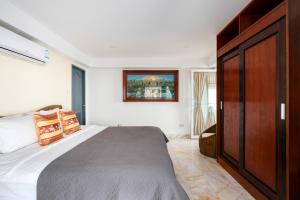 Postel nebo postele na pokoji v ubytování Tropical Villa 3