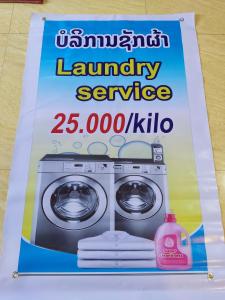 a book of laundry service with a washing machine at Erawan Guesthouse in Pakse