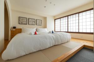 Cama ou camas em um quarto em Residence Yasushi