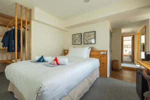 Cama ou camas em um quarto em Residence Yasushi