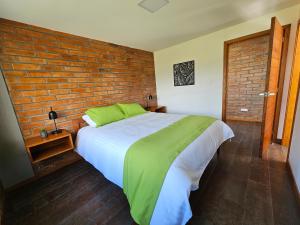 Cama o camas de una habitación en El Chasqui Guest House