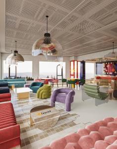 a lobby with couches and chairs and a table at Thien Thai Hotel & Spa in Hanoi