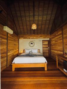 Tempat tidur dalam kamar di Uma Pantai Seseh