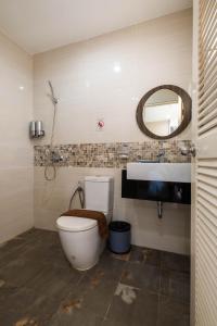 a bathroom with a toilet and a sink at Khao Rang Place in Phuket