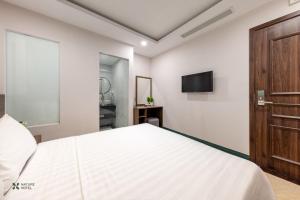 TV a/nebo společenská místnost v ubytování Nature Hotel