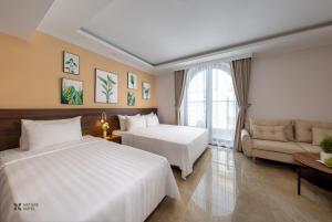 Voodi või voodid majutusasutuse Nature Hotel toas