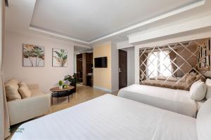 Voodi või voodid majutusasutuse Nature Hotel toas