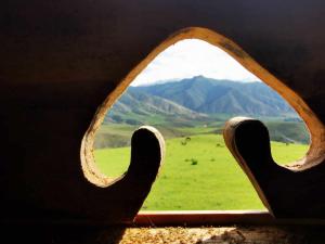 a view of a field from a window with horns at Yurt camp Besh-Karagai in Grigor'yevka