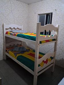 a pair of bunk beds in a room at Hotel pousada sonho meu in Arapiraca