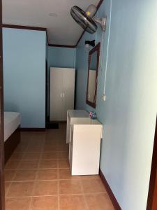 a bathroom with a white sink and a mirror at Adam Bungalows in Krabi town