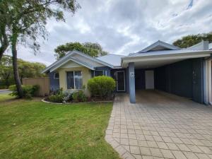 a house with a driveway in front of it at Villa Cinta @Cape View Resort in Broadwater