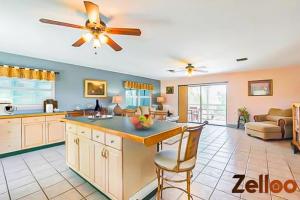 a kitchen and living room with a ceiling fan at Experience Coastal Living at its Best Florida Keys in Summerland Key