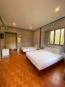 Giường trong phòng chung tại Mekong Riverside Homestay