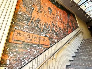 a building with a mural of deer on the wall at HOTEL FRONTIER YONAGO (ホテルフロンティア米子) in Yonago