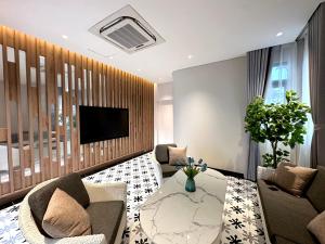 a living room with a couch and a table at 3BR Sonasea Villa - Casa Retreat Van Don in Cái Rồng +42 photos