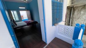 a hallway with a door leading to a room at Mayur Guest House in Pushkar