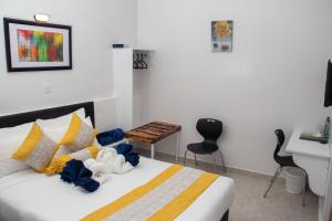 Postel nebo postele na pokoji v ubytování Eldorado Rustic Hotel