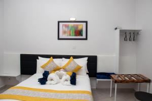 Ένα ή περισσότερα κρεβάτια σε δωμάτιο στο Eldorado Rustic Hotel