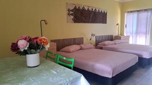 Letto o letti in una camera di Alec's Hotel