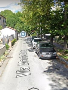 a street with cars parked on the side of the road at il Biscottino in Castel di Sangro