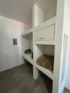 a white shelf in a room with at Casa Vivanco in Ensenada