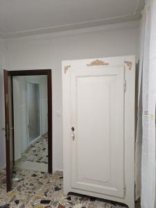 a white door in a room with a hallway at My Rialto Palace in Venice