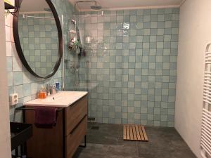 a bathroom with a sink and a mirror at Private 3 bedroom apartment - HomeStay Properties Amsterdam in Amsterdam