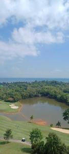 an aerial view of a large lake in a field at Apartemen Nuvasa Bay in Nongsa