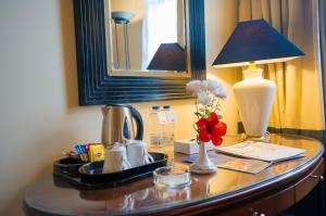 a table with a lamp and a coffee maker on it at Nuweiba Club Resort in Nuweiba