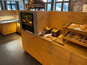a kitchen with a counter with bread on it at Antoniushof - inklusive Super Sommer Card in Serfaus