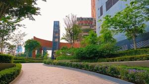 a walkway in front of a building in a city at Landing Park Lucentia Suite BBCC in Kuala Lumpur