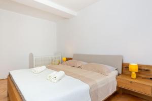 Posteľ alebo postele v izbe v ubytovaní Kuća za odmor s bazenom Emma + 28 fotografií