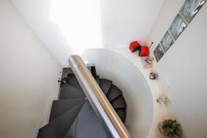 A seating area at Giresio 41 - Your Penthouse with Rooftop Garden in Milano Navigli - WIFI