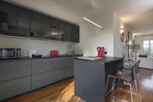 A kitchen or kitchenette at Giresio 41 - Your Penthouse with Rooftop Garden in Milano Navigli - WIFI